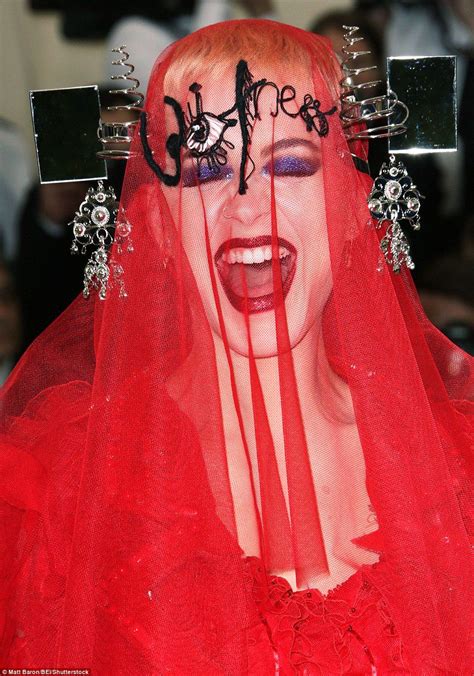 Katy Perry Wears John Galliano Red Gown With Face Veil At Met Gala
