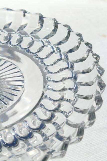 They say the earth laughs in flowers. vintage pressed glass cake stand, bullseye pattern ...
