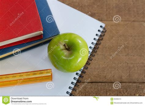 Green Apple And School Supplies On Wooden Table Stock Photo Image Of