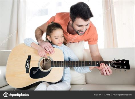 Father And Daughter Playing Guitar Stock Photo By ©natashafedorova