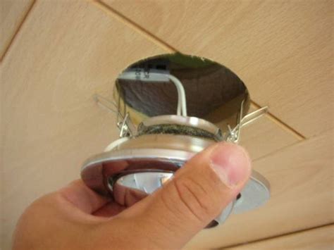 If there is no obvious fastener for the ring, but it refuses to twist out, it may be jammed. Fitting fire hoods | Light fitting