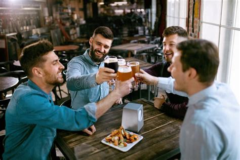 Men Drinking Beer In Pub Stock Photo Image Of Group 118329862