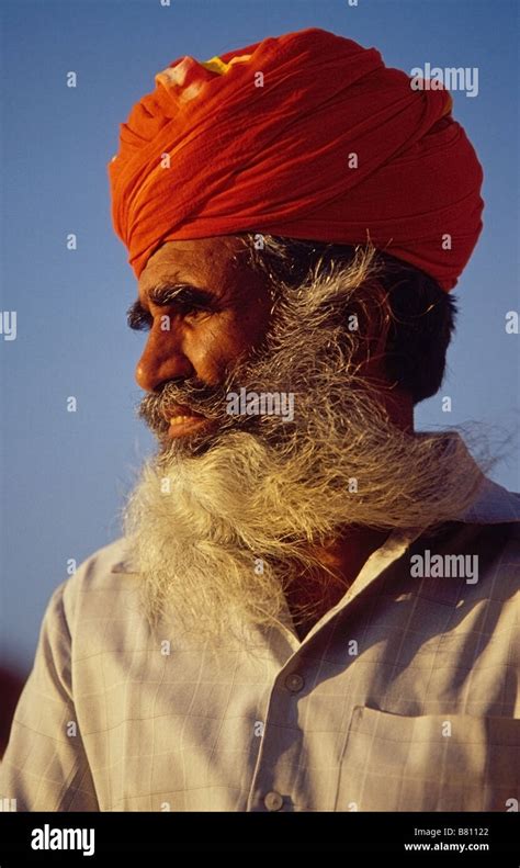 Portrait Of An Old Rajasthani Man With A Red Turban And An Impressive