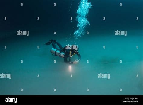 A Scuba Diver Hovers Above The Strange Hydrogen Sulfide Layer In Mexicos Famed Angelita Cenote