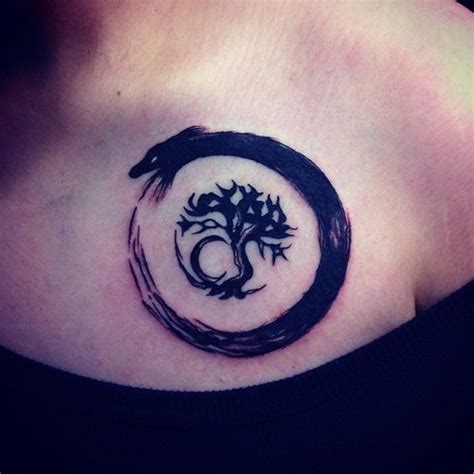 Black dotwork illuminati eye with snake tattoo on right forearm. small black and white snake tattoo