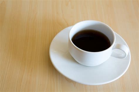 It can comfortably accommodate up to 5 cups of coffee. Coffee cup on the wooden table Photo | Free Download