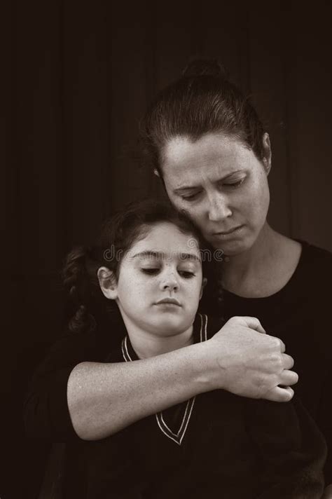 Sad Mother And Daughter Looking Away From Camera Stock Image Image Of
