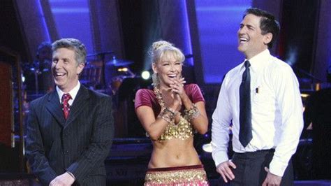 Kym Johnson And Mark Cuban Laughing With Tom Bergeron As They Listen To