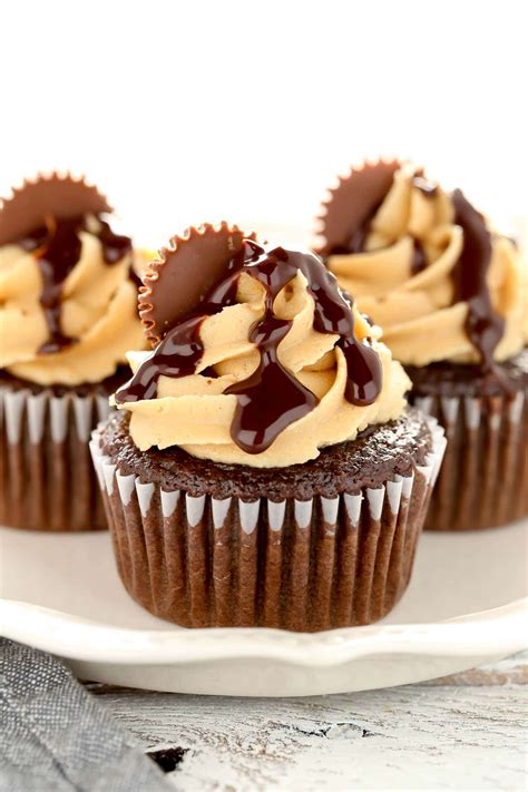 Spoon the batter into the prepared cups, dividing evenly. Chocolate Cupcakes with Peanut Butter Frosting
