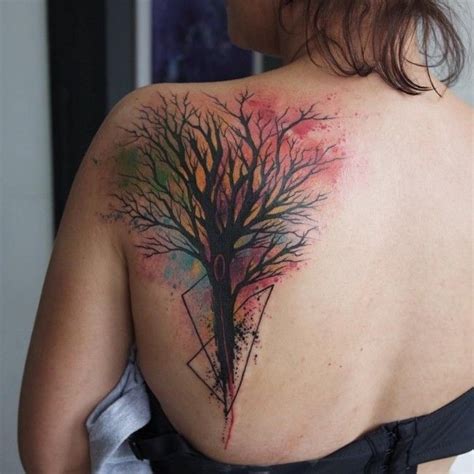 Watercolor Style Painted Colorful Tree Tattoo On Back With Black