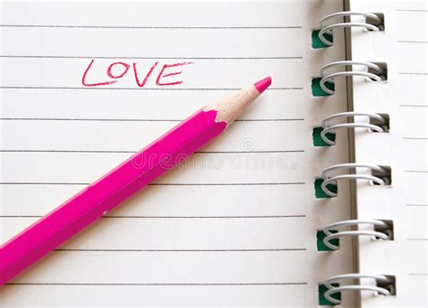 Word Love Written By Colored Pencil On Sheet Of Paper Background Stock