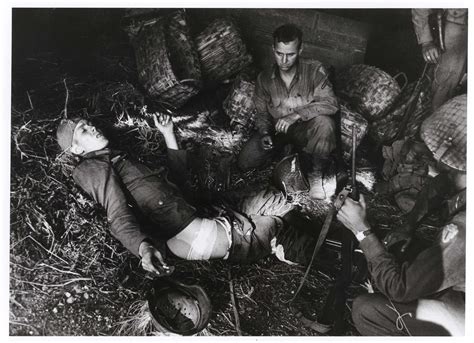 Wounded German Soldiers Discovered By American Forces In A Barn Along