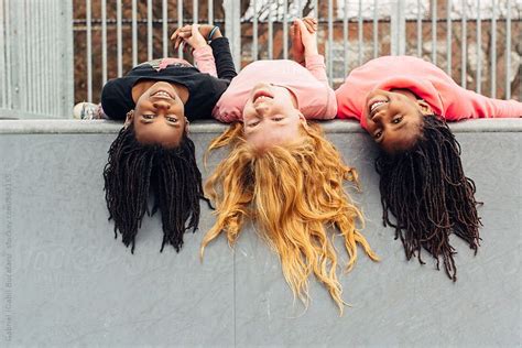 Upside Down African American And Caucasian Girls By Gabriel Gabi