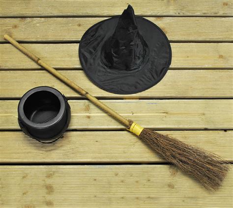 Halloween Witches Broom With Cauldron And Witches Hat By Garden