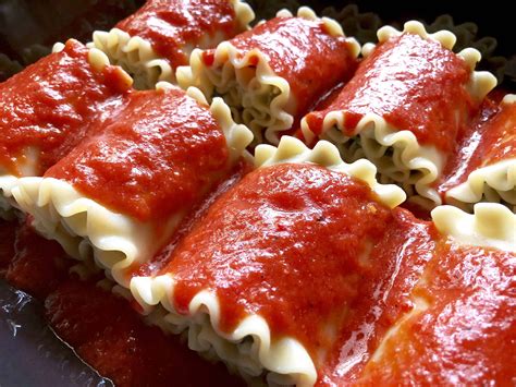 Lasagna Rolls With Roasted Red Pepper Sauce A Hint Of Rosemary