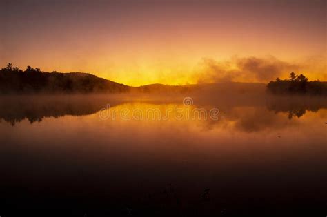 Sunrise Mist Over Mountainview Lake In Sunapee New Hampshire Stock