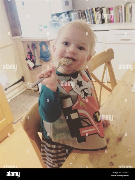 Baby Eating Porridge Stock Photo Alamy