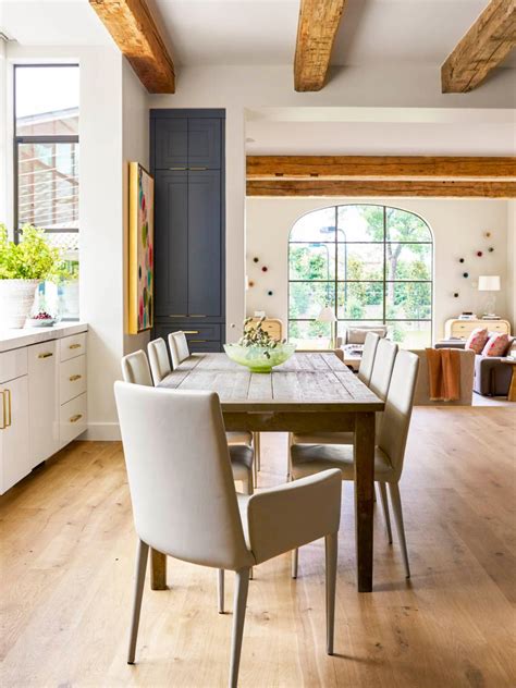 Open Floor Dining Room With Simple Wood Table And Neutral Contemporary