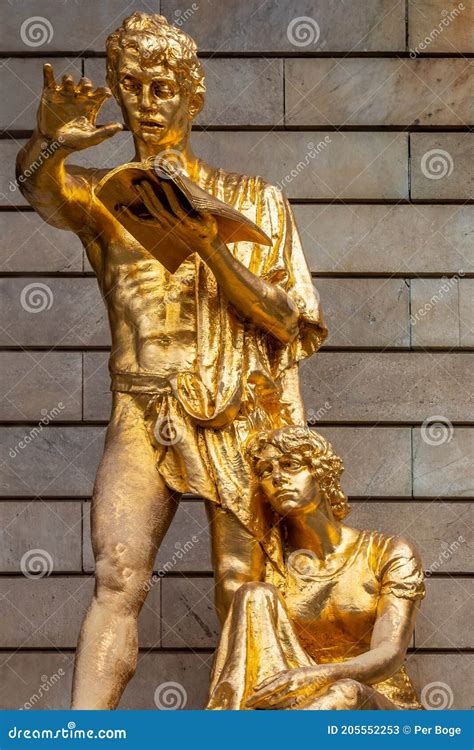 Golden Statues Of A Man And Woman Outside The Royal Dramatic Theater In