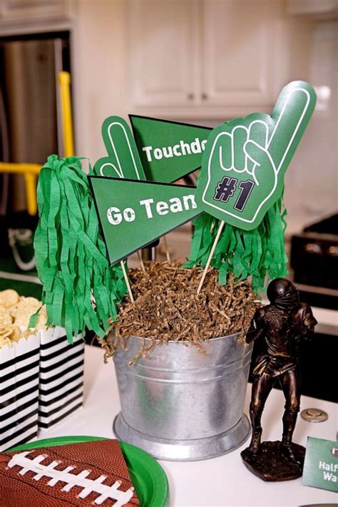 A Football Themed Party With Green And White Decorations