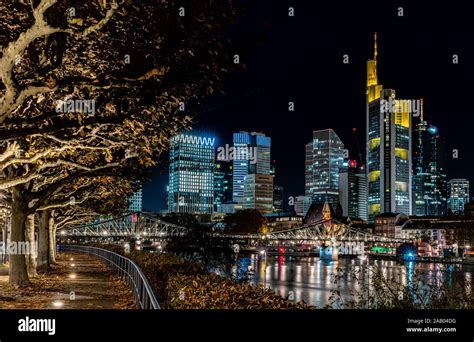 Frankfurt Skyline At Night With Colorful Reflections In The Main River