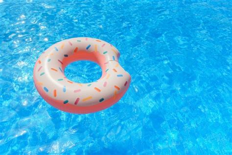 Premium Photo Inflatable Donut Floating In Swimming Pool