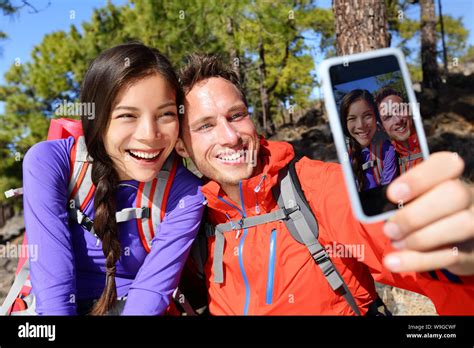 Happy Friends Hikers Taking Selfie On Hiking Trip Couple Posing For