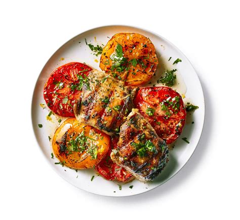 Serve with feta sauce alongside. Grilled Chicken with Tomatoes and Herb Oil Recipe | MyRecipes