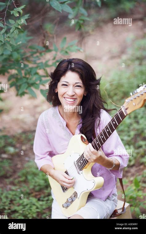 Portrait Of A Mature Woman Playing The Guitar Stock Photo Alamy