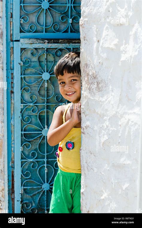 Young Smiling Indian Boy Standing In The Doorway Jodhpur Rajasthan