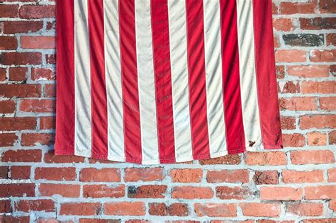 Free Stock Photo Of Stripes Of American Flag On Brick Wall
