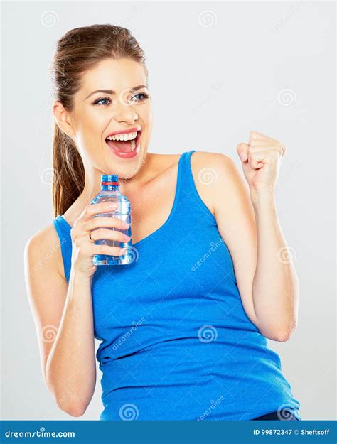 Portrait Of Athletic Woman With Bottle Of Water Posing Inn Stud Stock