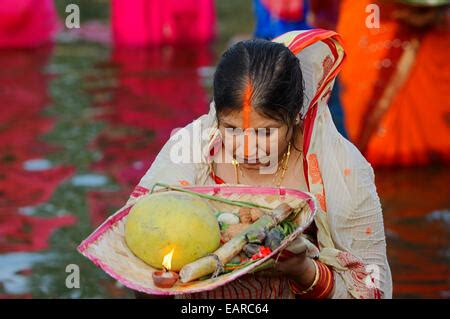 An Indian Hindu Woman Wearing A Sari Performs An Early Morning Bathing