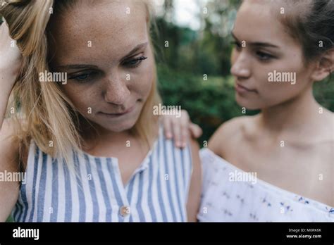 Young Woman Comforting Sad Female Friend Stock Photo Alamy