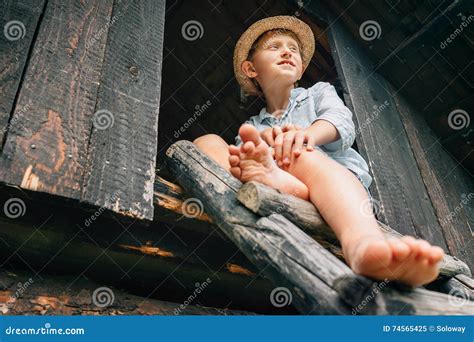 Barefoot Boy Sits On Ladder In Barn Attic Stock Image Image Of