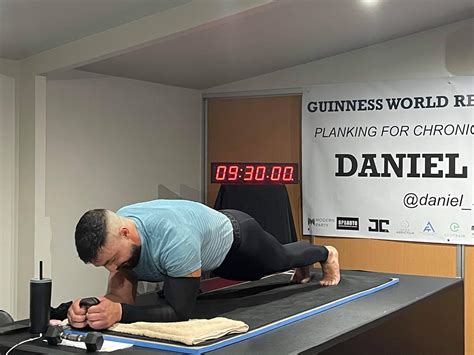 daniel scali receives guinness planking record