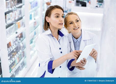 Two Women Pharmacists Standing In A Pharmacy Stock Photo Image Of