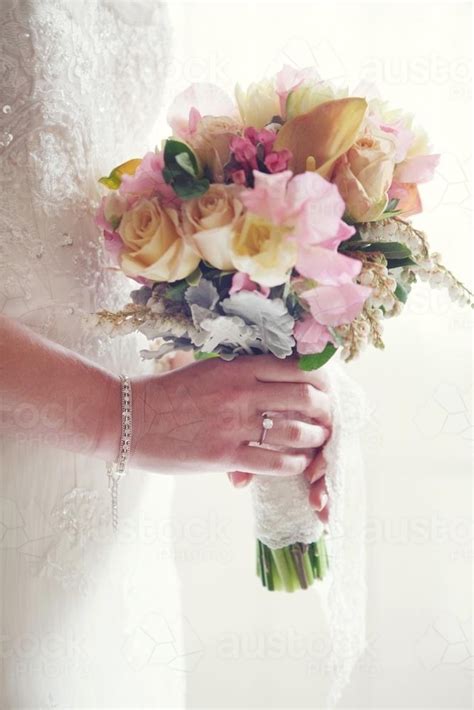 Image Of Bride Holding Bouquet Of Flowers Austockphoto