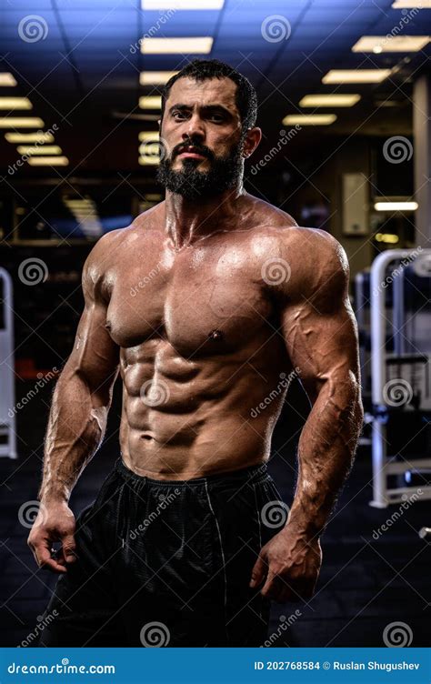 Strong Man With Perfect Sport Healthy Body Physique In Dark Fitness