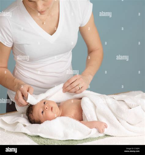 Mother Drying Newborn Baby After A Bath Stock Photo Alamy
