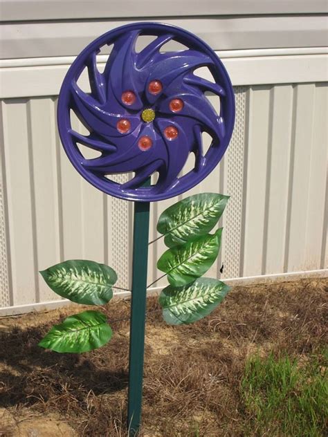 Hubcap Flower 1 Mom Painted It Purple I Made The Yellow Beaded