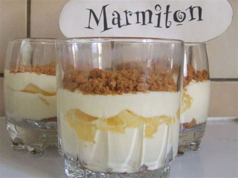 Two glasses filled with dessert sitting on top of a counter
