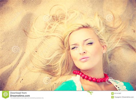 woman lying on sandy beach relaxing during summer stock image image of sandy sunlight 91141597