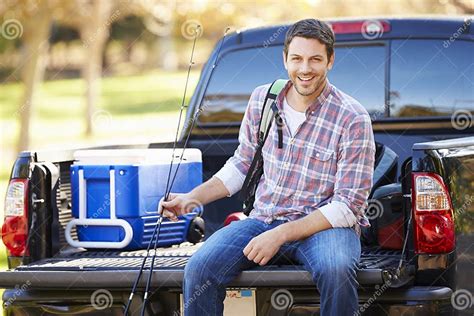 Man Sitting In Pick Up Truck On Camping Holiday Stock Image Image Of