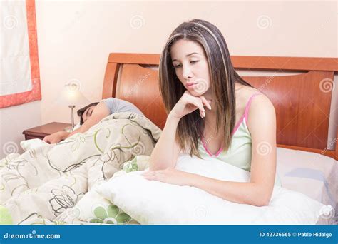 Tired Woman Lying In Bed Next To Sleeping Stock Image Image Of Marriage Love 42736565