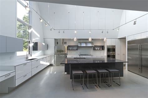 It is not generally considered a structural element, but a finished surface concealing the underside of the roof structure. Modern Massachusetts Forest House With Two-Story Ceilings
