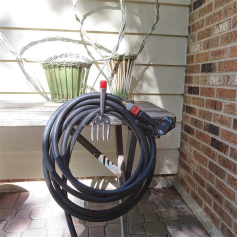 Ou can mount it right to the side of your home where your outdoor faucet is. anything goes here: diy garden hose holder. a simple ...
