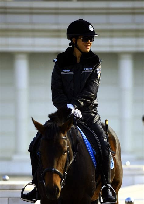 Dalians Mounted Policewoman In Full Leather Uniform