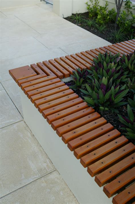 Timber Slats On Top Of A Retaining Wall To Create A Bench Patio