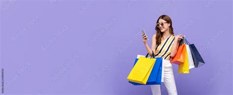 Beautiful Asian Woman Carrying Colorful Bags Shopping Online With